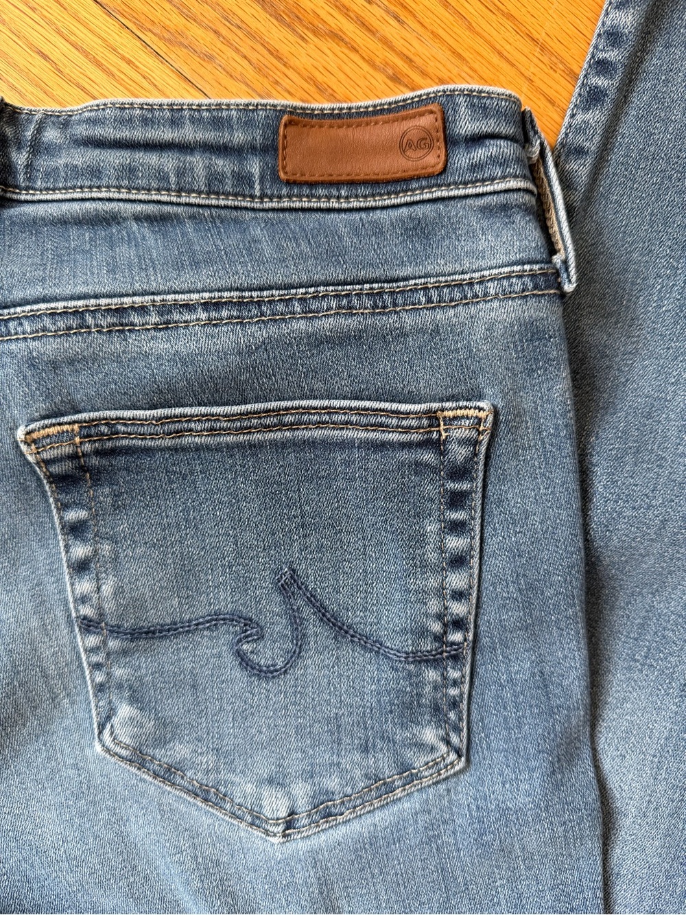 Ag Adriano Goldschmied Women's Medium Wash Blue Jeans with Leather Logo Patch